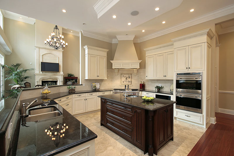 Cream kitchen cabinets with uba tuba granite