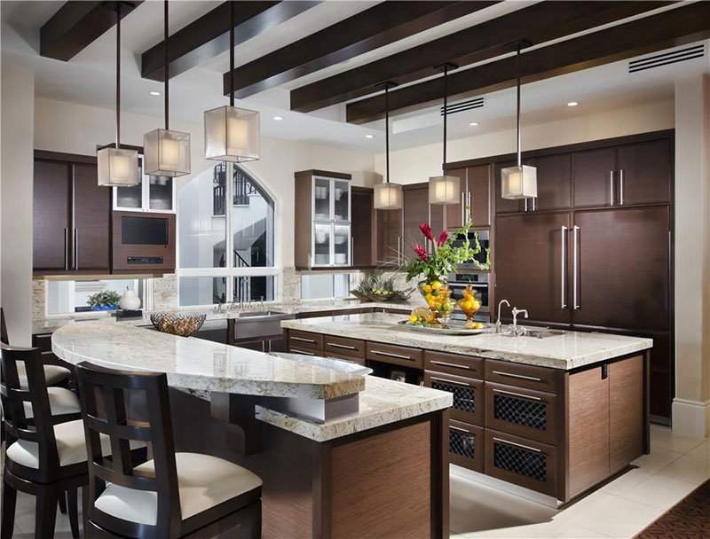 Dark brown cabinets with bianco romano granite