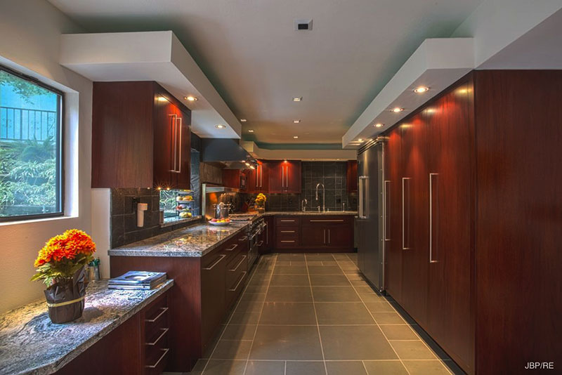 Modern kitchen with bianco antico granite countertops and subway tile