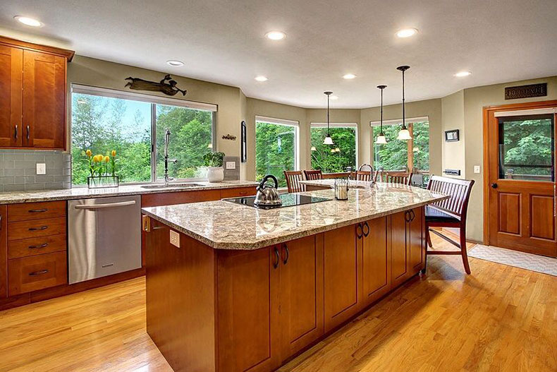 Bianco antico granite countertops with maple cabinets