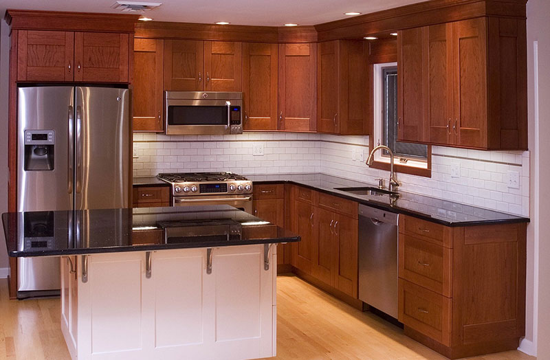 Polished black granite countertops with cherry cabinets