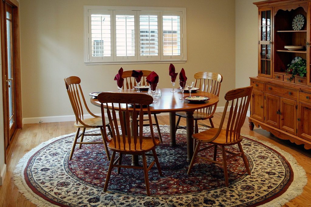 yellow rug in dining room