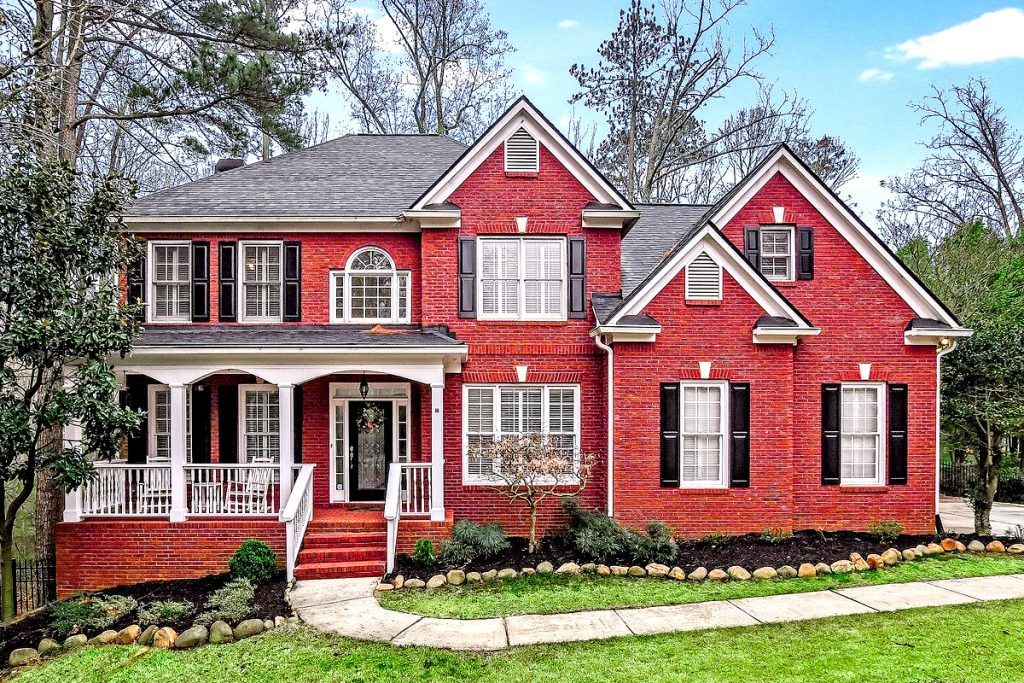 Red-Brick-House-Exterior-Southern Porch Charm in Classic Red Bric