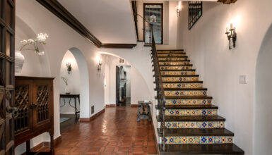 Spanish Interior Staircase Ideas With Tile Risers and Wrought Iron Style