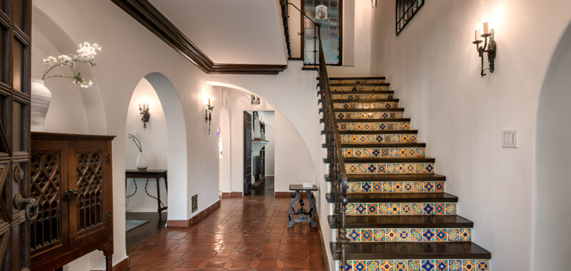 Spanish Interior Staircase Ideas With Tile Risers and Wrought Iron Style