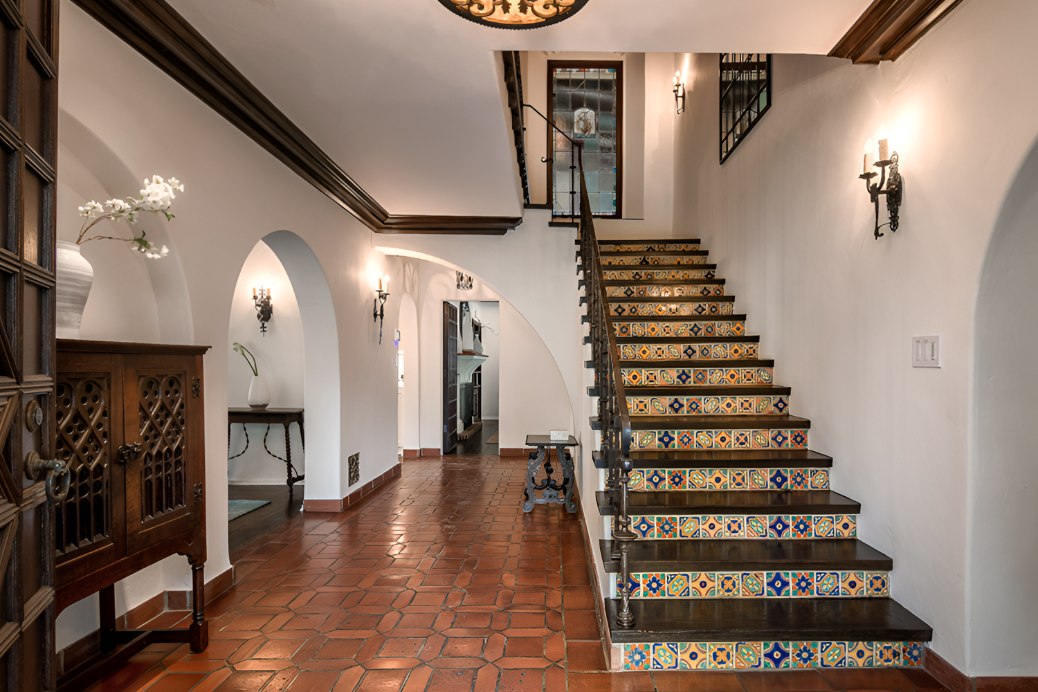 Spanish Interior Staircase Ideas With Tile Risers and Wrought Iron Style