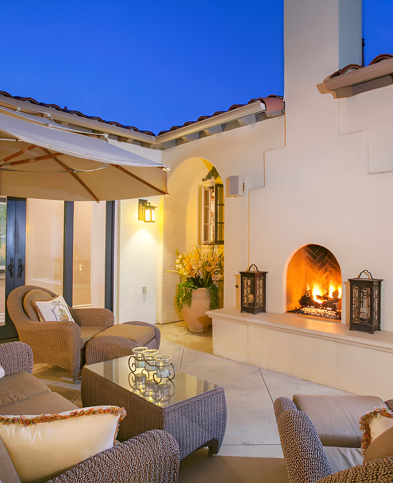 Spanish-Style Patio With Arched Fireplace