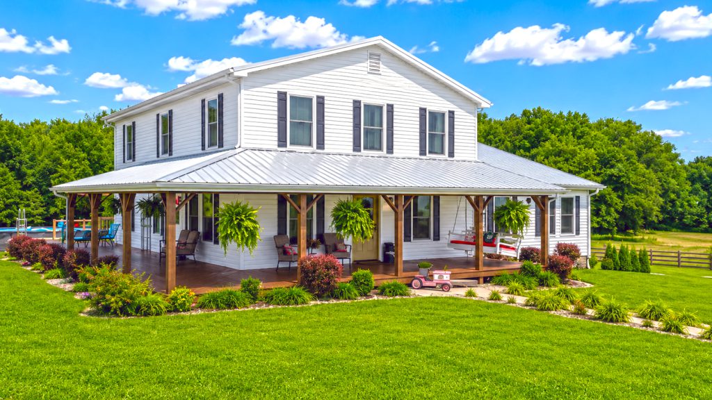 Wide Country Porch With Hanging Ferns